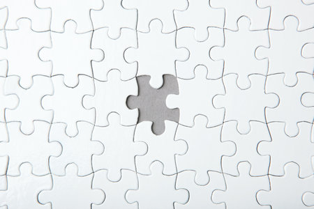 White puzzle on a colored background top view.の写真素材