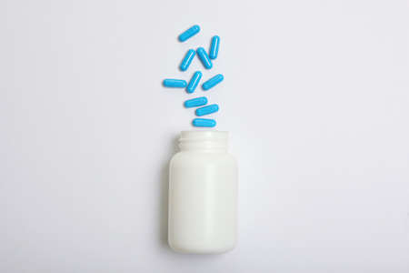 pills on a light background top view. Medicine, treatment, illness.の写真素材