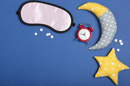 Composition on the theme of insomnia on a colored backgroundの写真素材