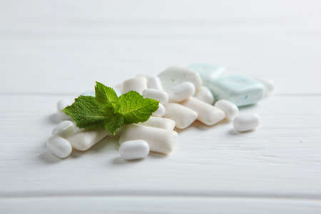 mint chewing gum and mint on the table. Fresh breath, oral careの写真素材