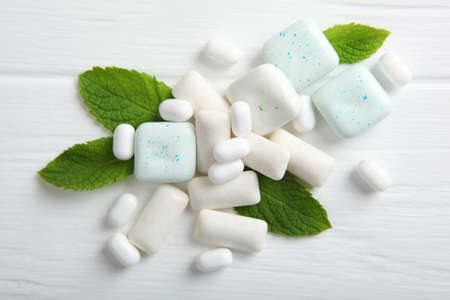 mint chewing gum and mint on the table. Fresh breath, oral careの写真素材