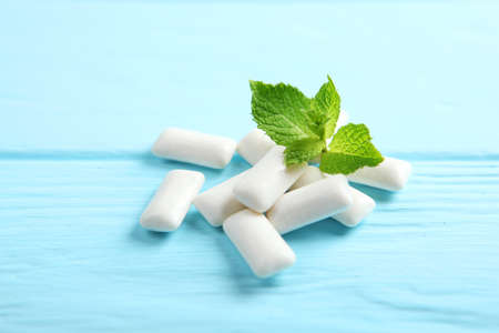 mint chewing gum and mint on the table. Fresh breath, oral careの写真素材