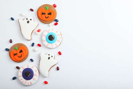 Halloween background with gingerbread and other sweets with place for textの写真素材