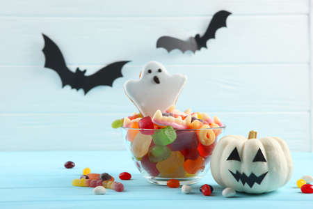 Halloween background with gingerbread and other sweets with place for textの写真素材