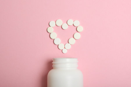 pills on a colored background top view. Medicine, treatment, illness.の写真素材