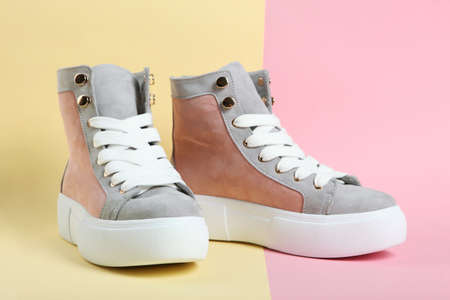 Warm and beautiful womens shoes on a colored background close-up.の写真素材