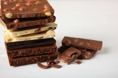 Chocolate of different types on a colored background with a place for text