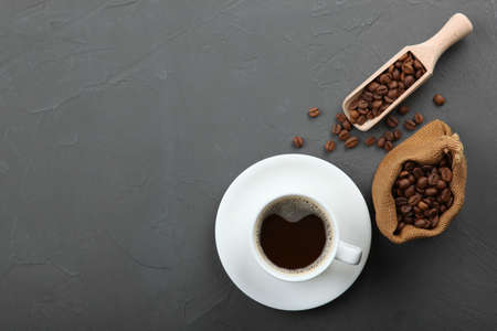 coffee beans and coffee cup on colored background with place for textの写真素材