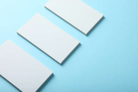business cards on a colored background top view. Place to insert text
