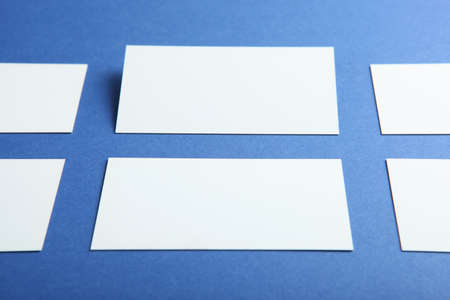 business cards on a colored background top view. Place to insert text