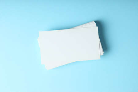 business cards on a colored background top view. Place to insert textの写真素材