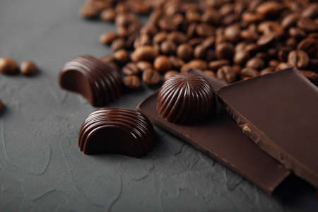 coffee beans and chocolate on the tableの写真素材