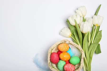 Easter eggs and flowers on the table top view.の写真素材