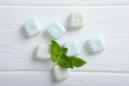 mint chewing gum and mint on the table. Fresh breath, oral care