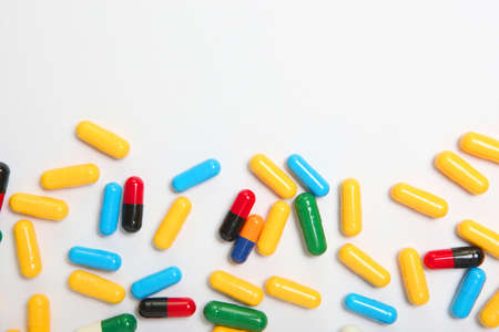 pills on a light background top view. Medicine, treatment, illness.の写真素材