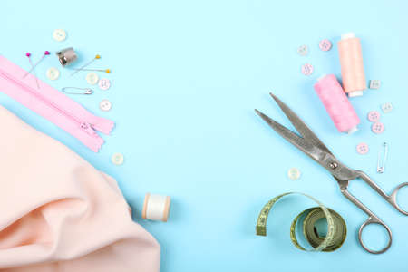 different sewing accessories on the table.