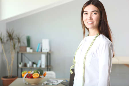 doctor nutritionist in her office demonstrates the concept of healthy eating.の写真素材