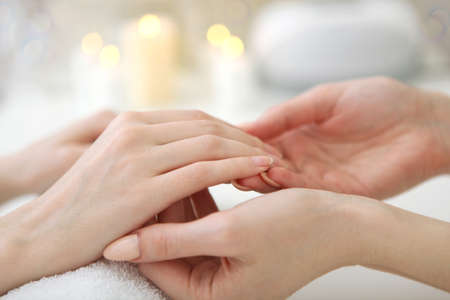 Closeup shot of a woman in a nail salon getting a manicureの写真素材