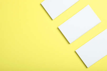 business cards on a colored background top view. Place to insert text