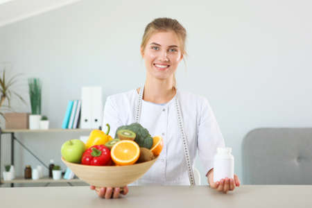 doctor nutritionist in her office demonstrates the concept of healthy eating.の写真素材