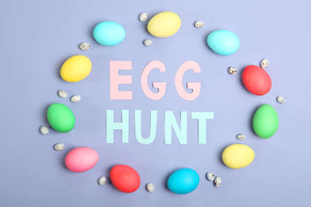 Easter eggs and flowers on the table top view.の写真素材