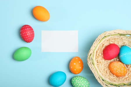 Easter eggs and flowers on the table top view.の写真素材