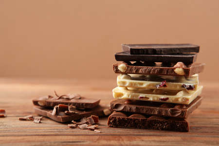Chocolate of different types on a colored background with a place for text