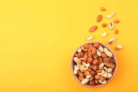 A set of different nuts on the table.の写真素材