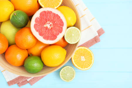 Different citrus and juicy slices on a colored background. Place to insert text.の写真素材