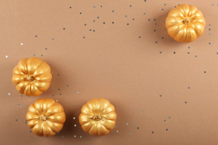 Beautiful stylish autumn background with golden leaves top viewの写真素材