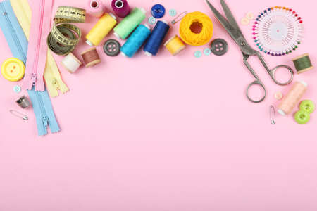 different sewing accessories on the table.