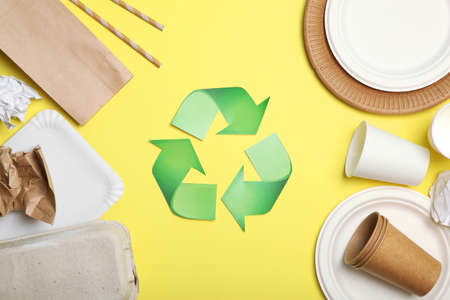 garbage and recycling sign on a colored background top view.