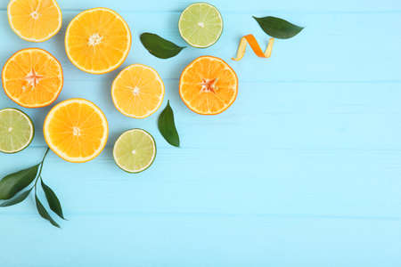 Different citrus and juicy slices on a colored background. Place to insert text.の写真素材
