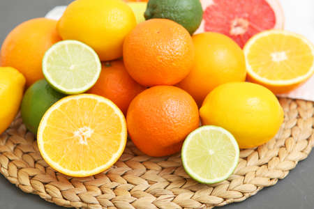 Different citrus and juicy slices on a colored background. Place to insert text.の写真素材