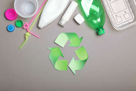 garbage and recycling sign on a colored background top view.