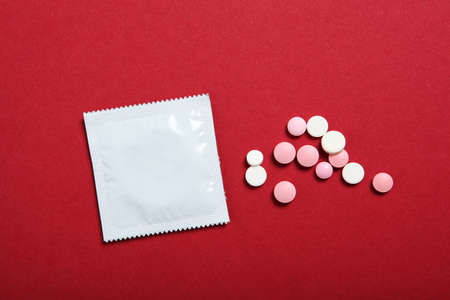 condoms and other contraceptives on a colored backgroundの写真素材