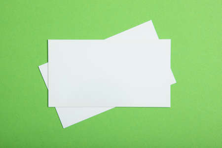 business cards on a colored background top view. Place to insert text