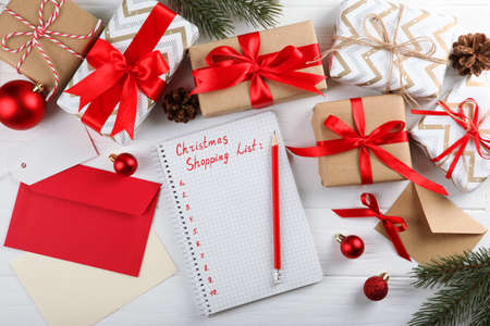 Christmas shopping list. Composition on the theme of christmas shopping top viewの写真素材