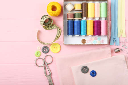 different sewing accessories on the table.