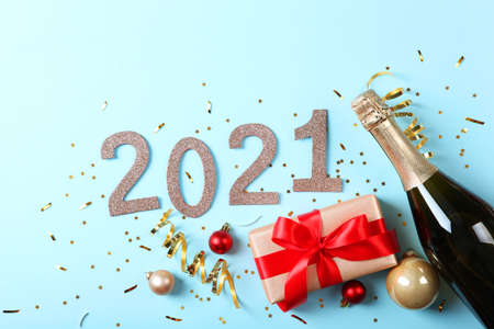 Composition with numbers 2021 and Christmas decor on a colored backgroundの写真素材