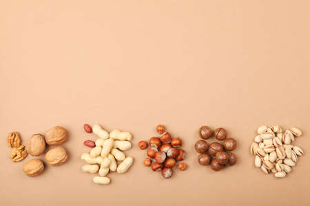 A set of different nuts on the table.の写真素材
