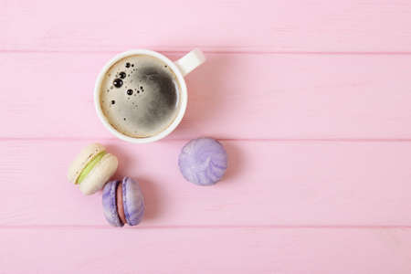 macaroons on a colored background top view.