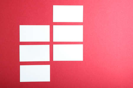 business cards on a colored background top view. Place to insert textの写真素材