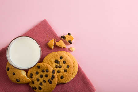 Delicious cookies with chocolate chips on a colored backgroundの写真素材