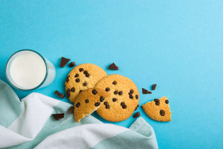 Delicious cookies with chocolate chips on a colored backgroundの写真素材