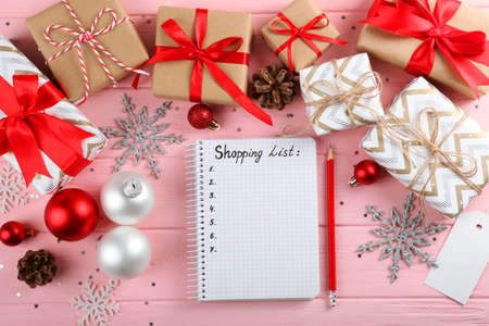 Christmas shopping list. Composition on the theme of christmas shopping top viewの写真素材