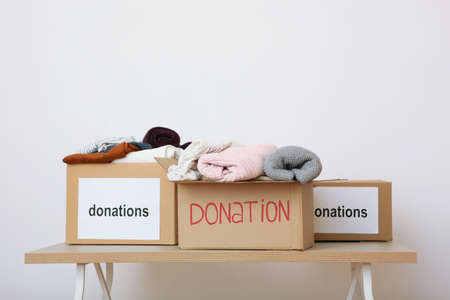boxes with donations with the necessary things on the tableの写真素材