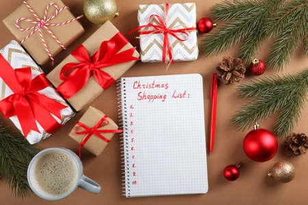 Christmas shopping list. Composition on the theme of christmas shopping top view