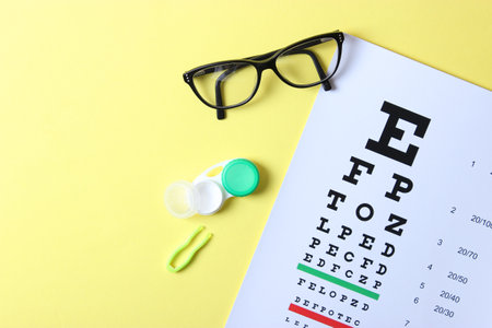 table for checking vision, glasses and lenses for correcting visionの写真素材