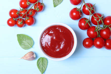 Ketchup on the table. Tomato sauce, fresh tomatoes.